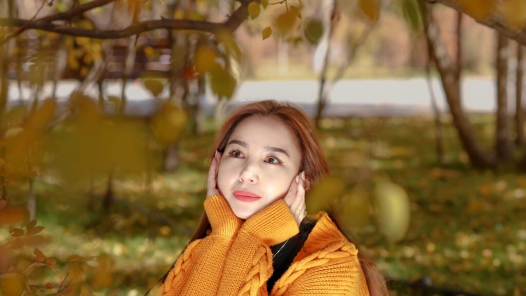 woman in a cozy sweater enjoying a relaxed autumn day