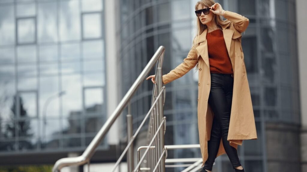 confident woman in professional attire on city stairs